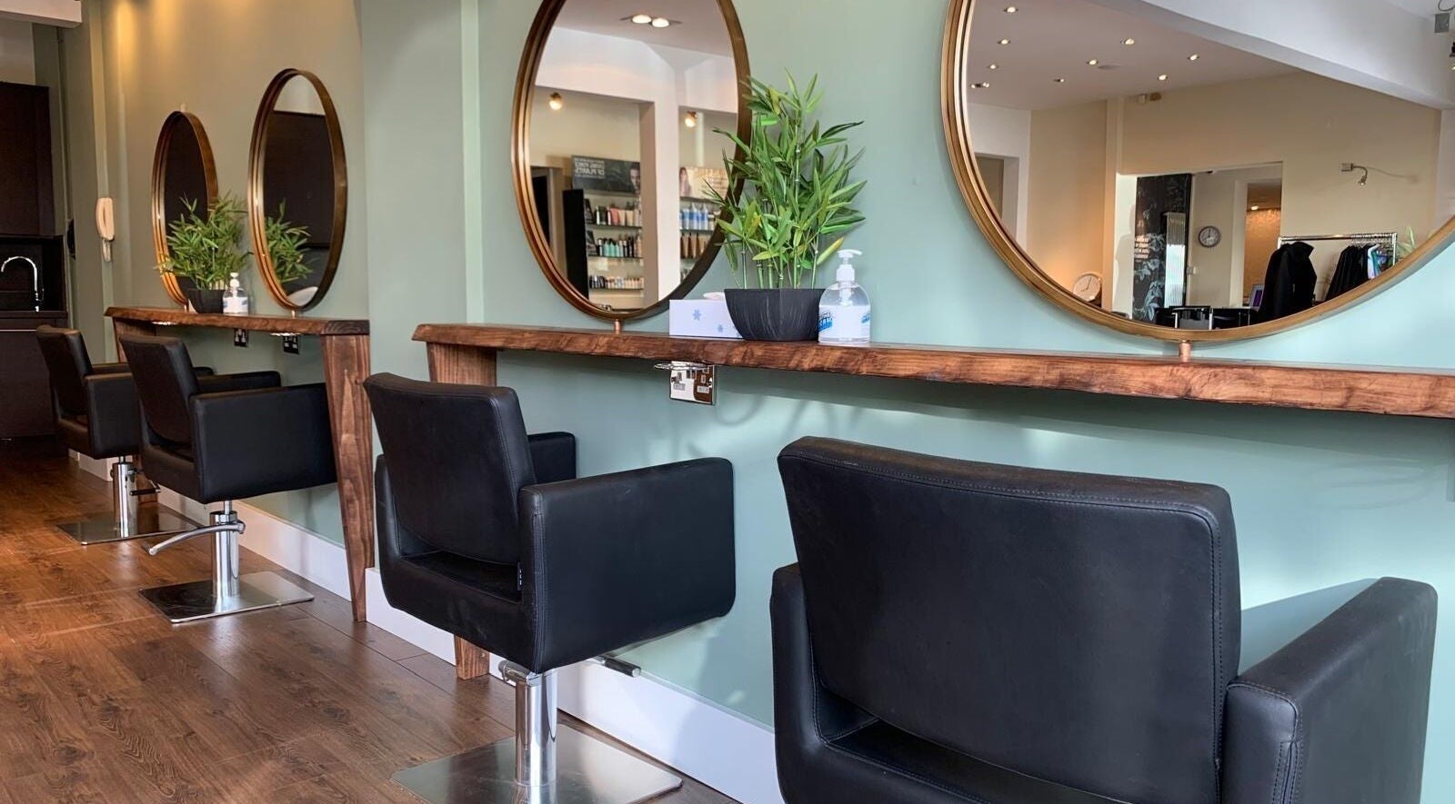 Elegant styling stations at Hair By Karolina, Bolton, England, GB offer a modern and cozy atmosphere.