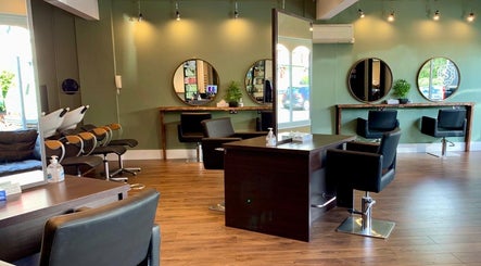Modern salon chairs and mirrors at Hair By Karolina, Bolton, England, GB offering a stylish beauty experience.