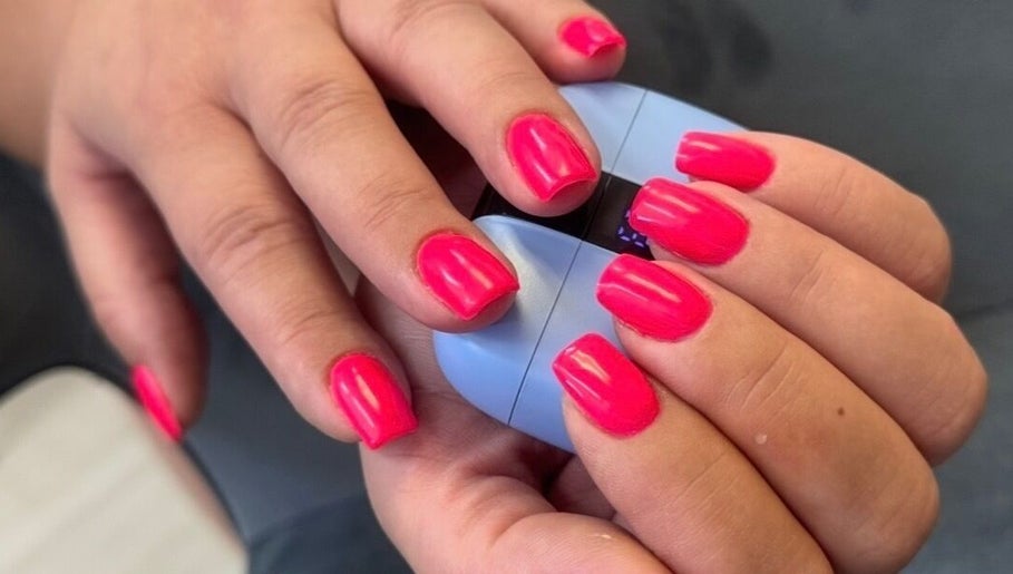Bright pink nails polished at YULIA_NAILS_MTL in Montréal, Québec, CA, showcasing professional nail care.