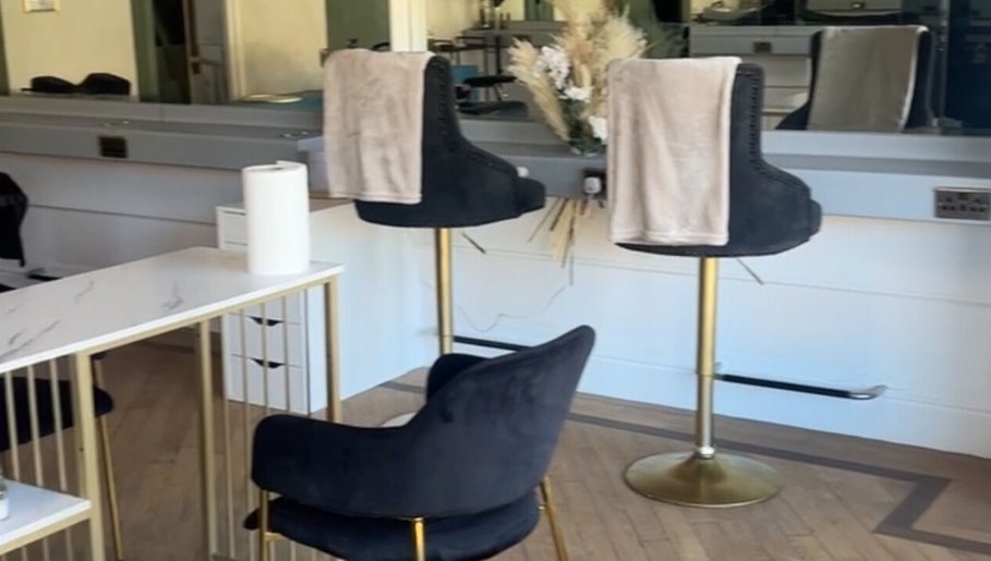 Chic seating area inside Heavenly Hideaway, Leeds, England, GB, with plush chairs and stylish decor.