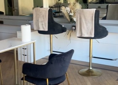 Chic seating area inside Heavenly Hideaway, Leeds, England, GB, with plush chairs and stylish decor.