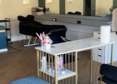 Elegant beauty salon at Heavenly Hideaway in Leeds, England, GB, featuring plush seating and modern decor.