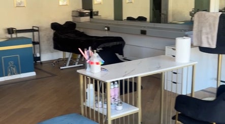 Elegant beauty salon at Heavenly Hideaway in Leeds, England, GB, featuring plush seating and modern decor.