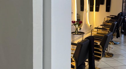 Modern salon chairs at The Royal house, Emalahleni, Mpumalanga, ZA, with elegant lighting and decor.