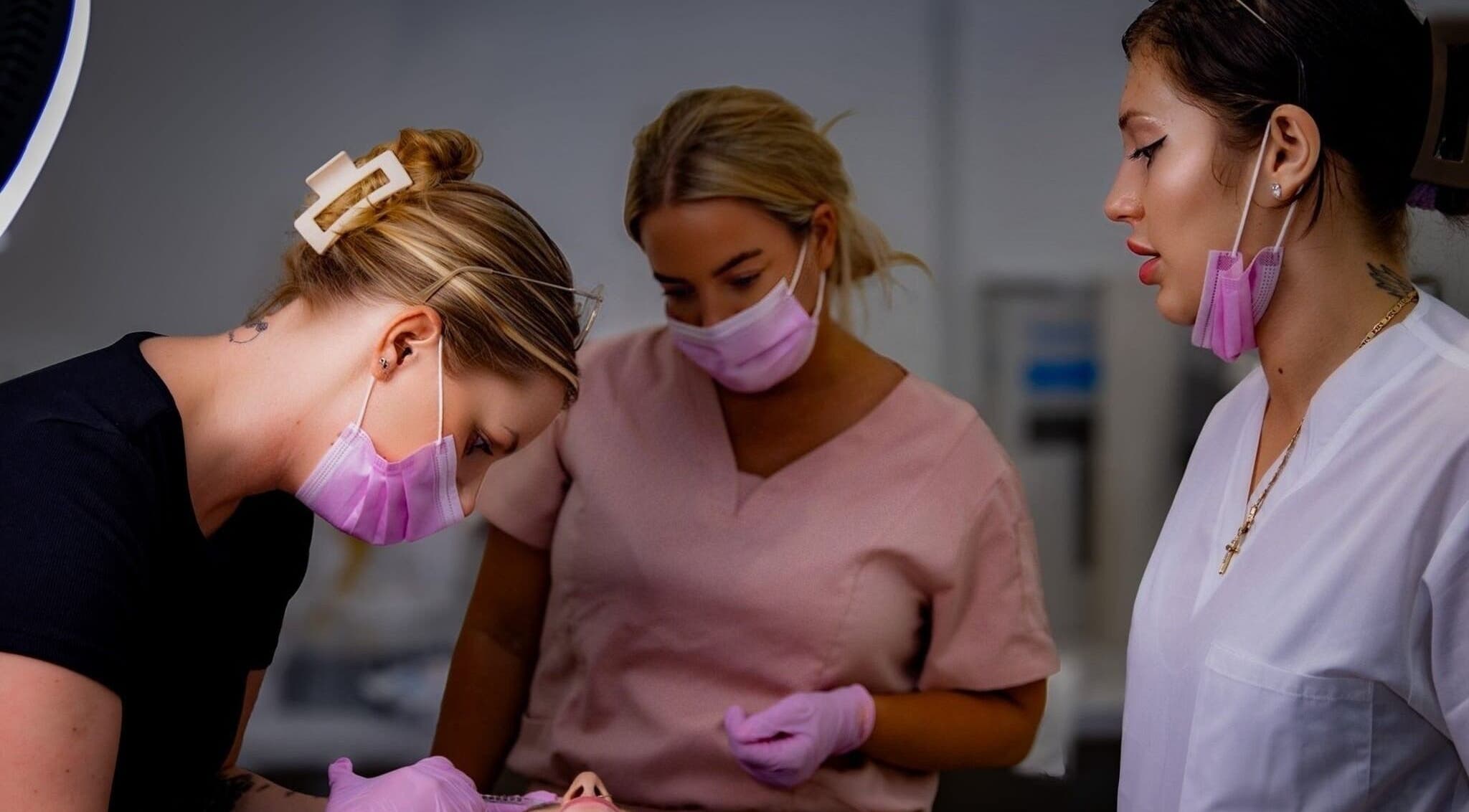 Professionals at Diamond M Aesthetics in Brighton and Hove, England, GB, engage in a beauty treatment session.