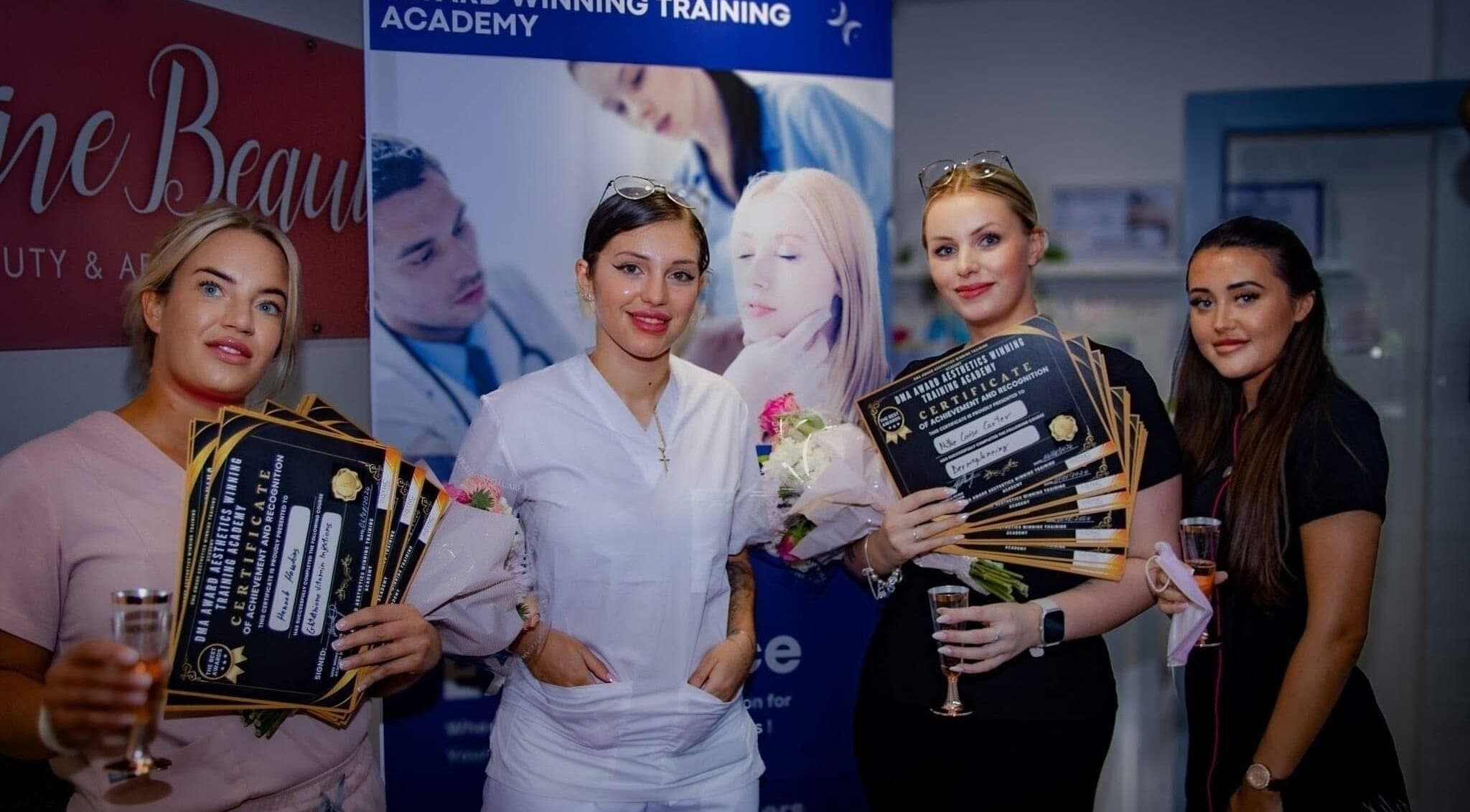Celebration at Diamond M Aesthetics in Brighton and Hove, England, GB with certificates and smiling attendees.