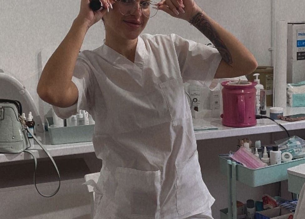 Beautician at Diamond M Aesthetics, Brighton and Hove, England, GB, preparing tools for a skincare session.