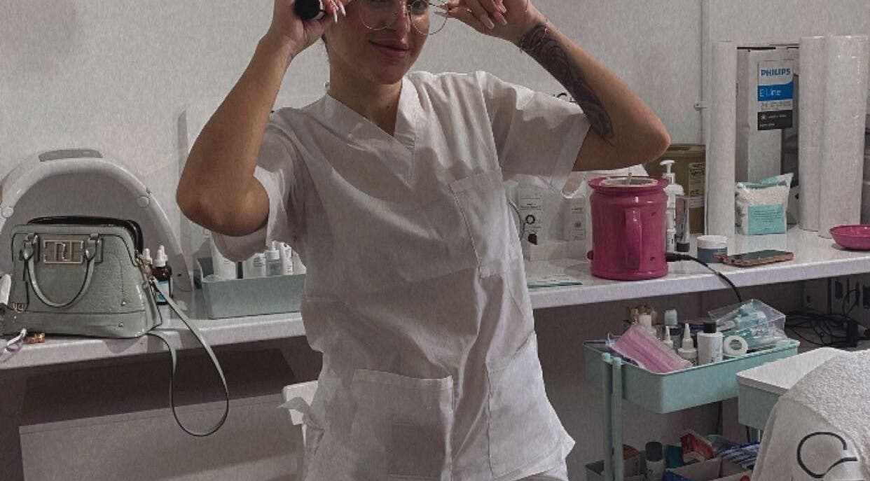 Beautician at Diamond M Aesthetics, Brighton and Hove, England, GB, preparing tools for a skincare session.