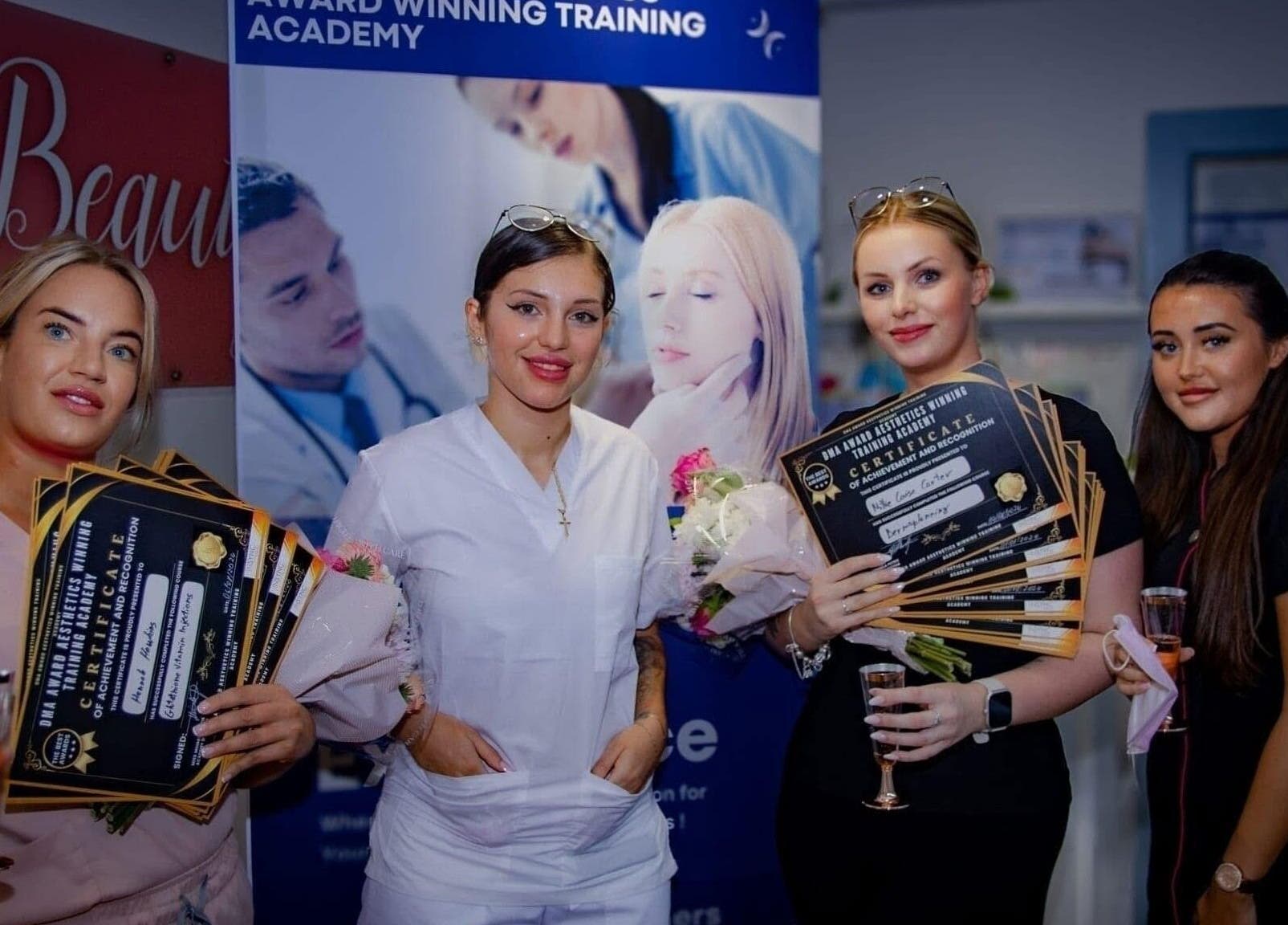 Diamond M Aesthetics team celebrates achievements in Brighton and Hove, England, GB with certificates and smiles.