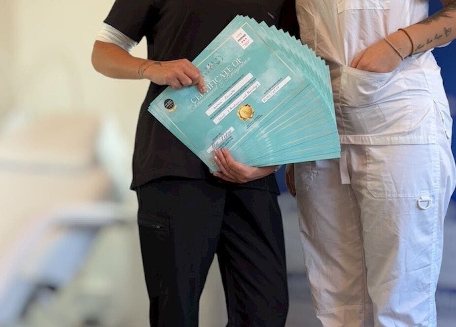 Team at Diamond M Aesthetics, Brighton and Hove, England, displays multiple certificates with pride.