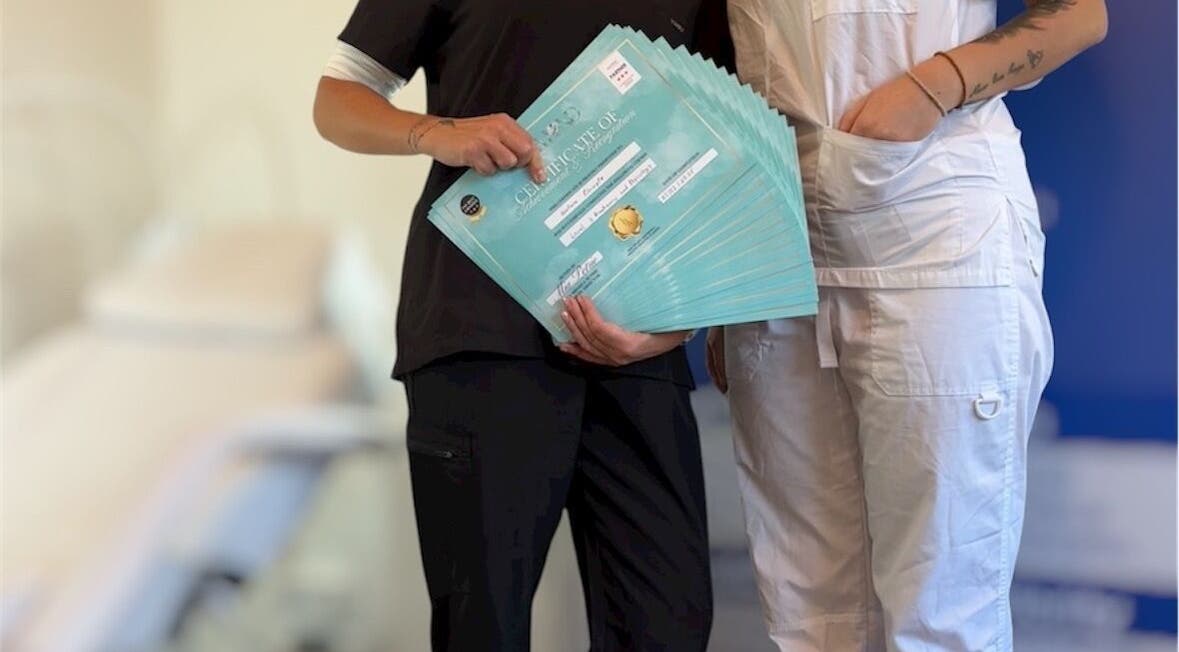 Team at Diamond M Aesthetics, Brighton and Hove, England, displays multiple certificates with pride.