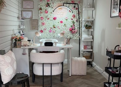 Relaxing salon setup at Envy Beauty Studio, Scarborough, England, with floral decor and cozy seating.
