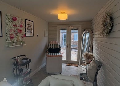 Interior view of Envy Beauty Studio in Scarborough, England, GB, showcasing a cozy treatment space.