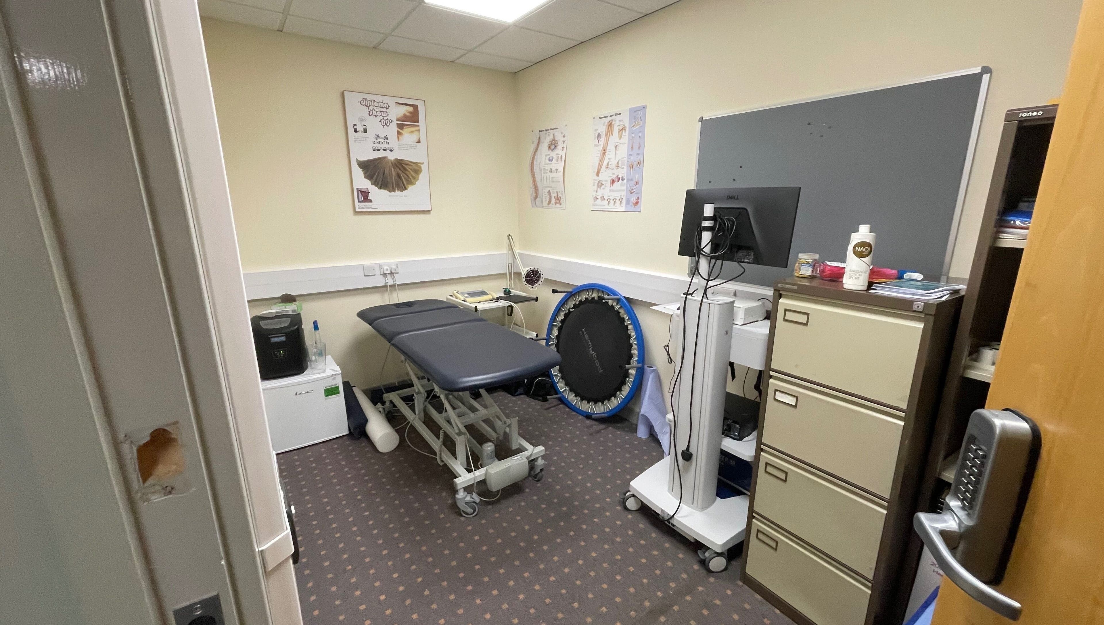 Professional treatment room at Limb Therapy, Kettering, England, GB featuring equipment and calming decor.