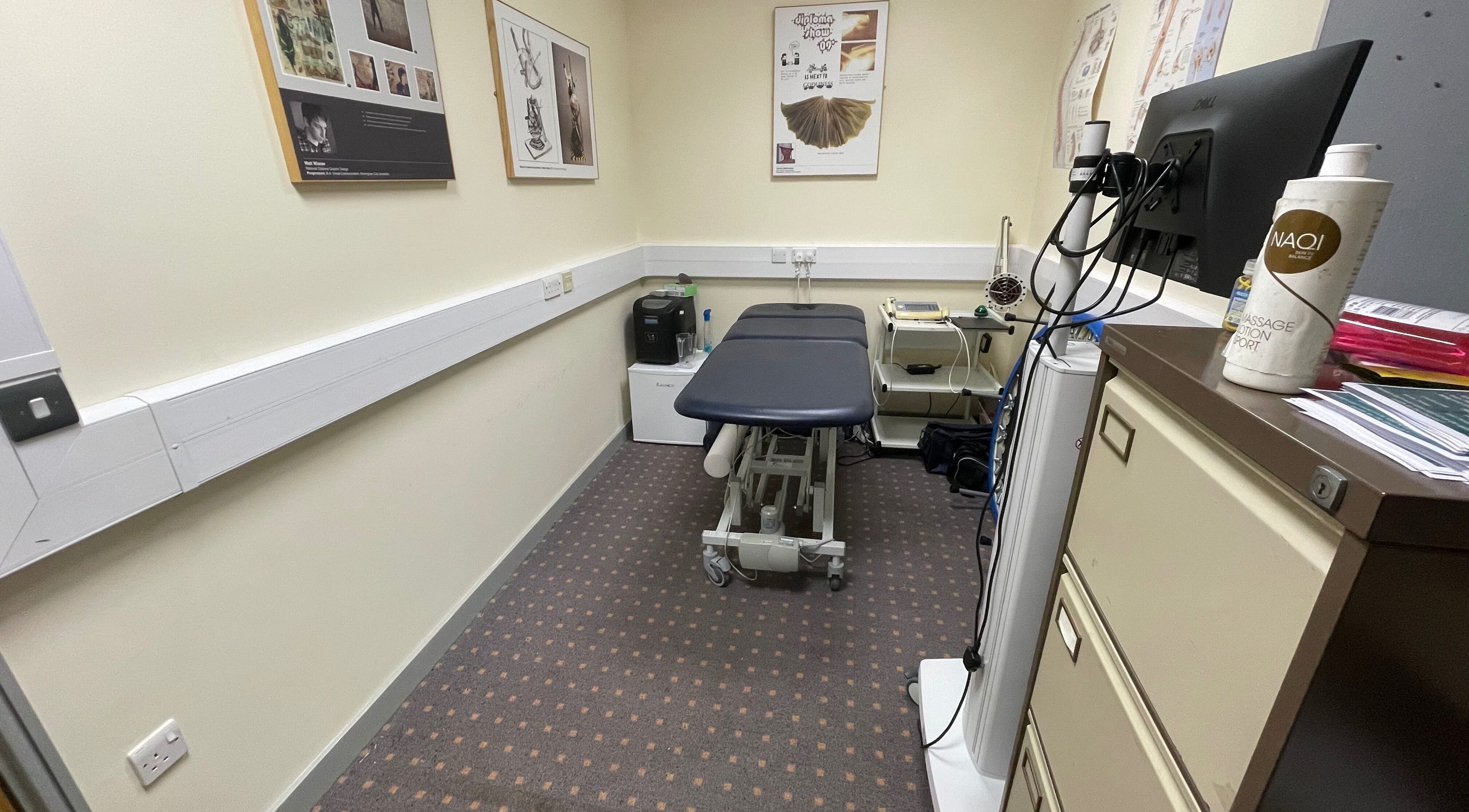 Treatment room at Limb Therapy, Kettering, England, GB, featuring a massage table and wellness equipment.