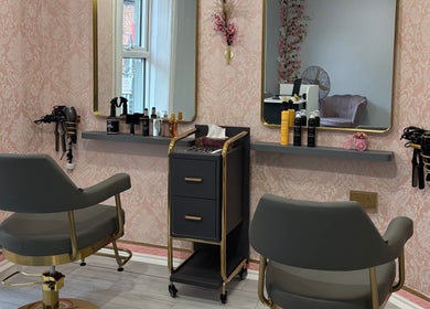 Stylish salon interior at Ane Hair Cork, Cork, County Cork, IE with modern chairs and beauty products displayed.