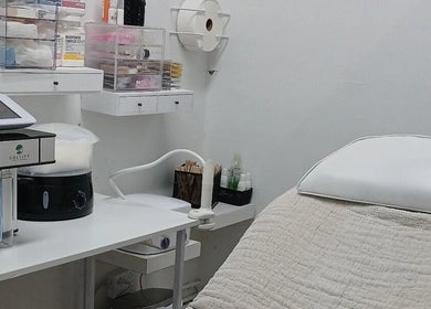 Modern treatment room at Beauty Fits All, Florida, Florida, US, featuring a comfortable bed and equipment.