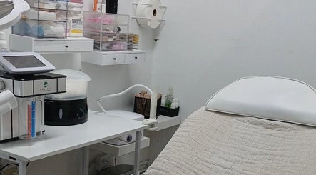 Modern treatment room at Beauty Fits All, Florida, Florida, US, featuring a comfortable bed and equipment.