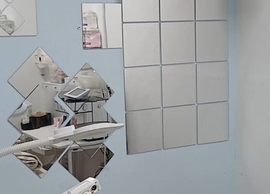 Modern treatment room at Beauty Fits All, Florida, Florida, US featuring sleek mirrors and advanced equipment.