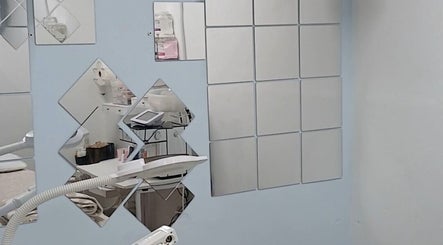 Modern treatment room at Beauty Fits All, Florida, Florida, US featuring sleek mirrors and advanced equipment.