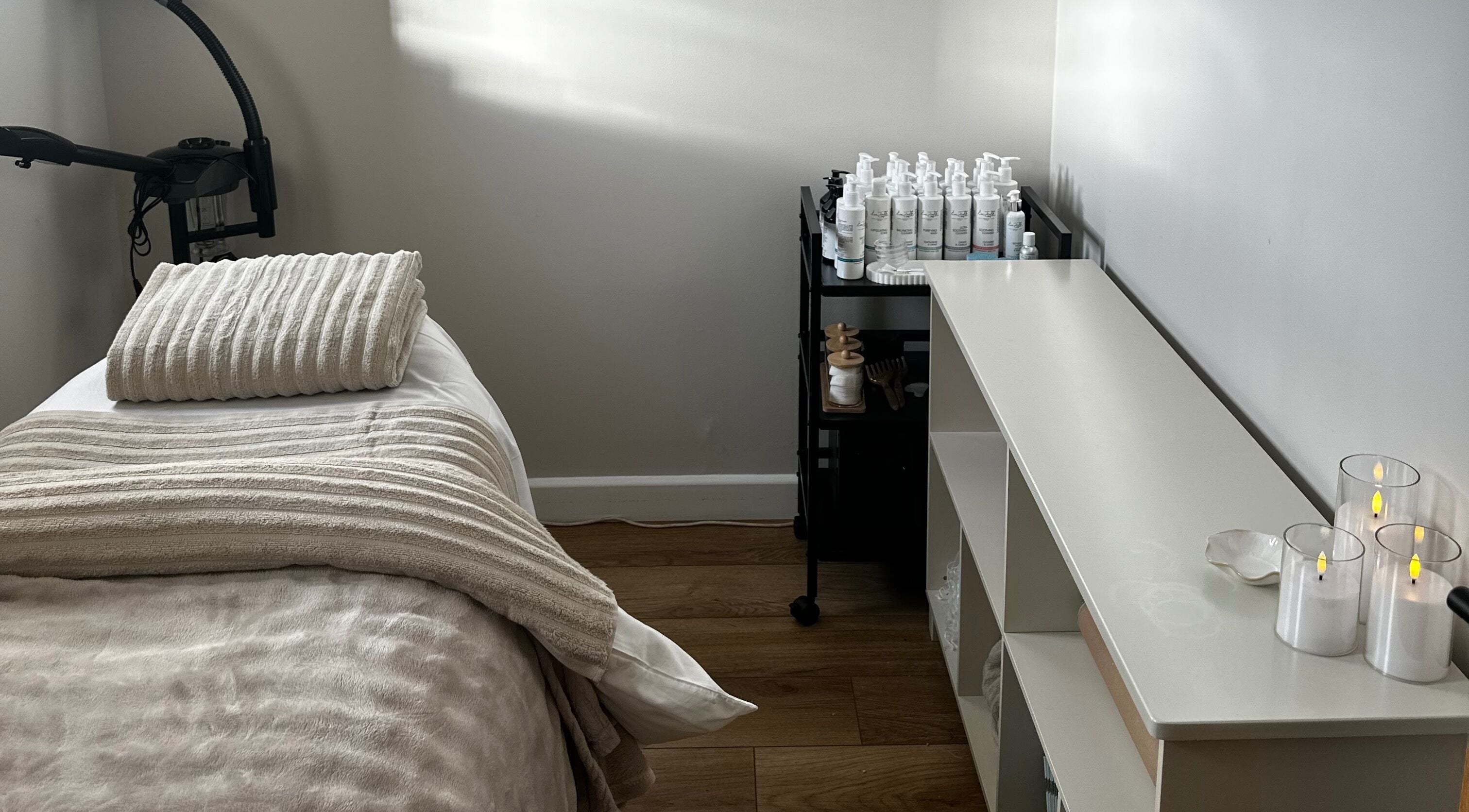 Relaxing treatment room with massage bed at Beauty by Claudie in Gamlingay, England, GB.