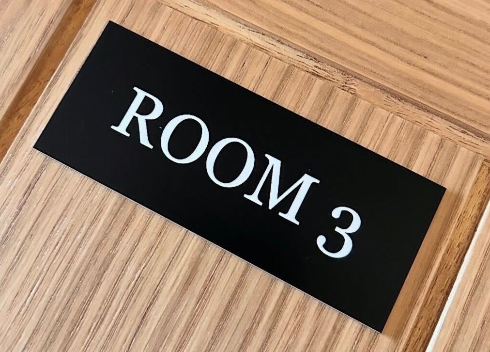Room 3 sign on wooden door at Beauty by Claudie, Gamlingay, England, GB.