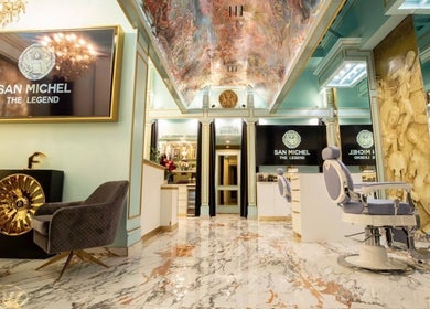 Elegant interior of San Michel The Legend Barbershop, Glendale, California, US with luxurious décor and seating.