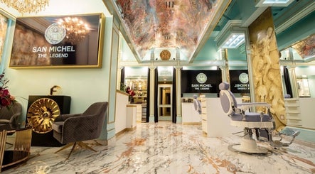 Elegant interior of San Michel The Legend Barbershop, Glendale, California, US with luxurious décor and seating.
