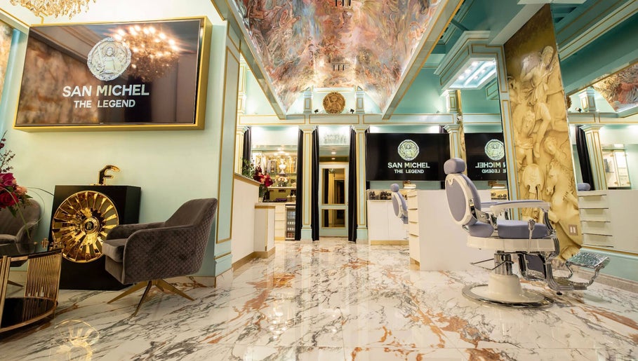 Elegant interior of San Michel The Legend Barbershop in Glendale, California, US with opulent decor and barber chairs.