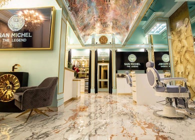 Elegant interior of San Michel The Legend Barbershop in Glendale, California, US with opulent decor and barber chairs.