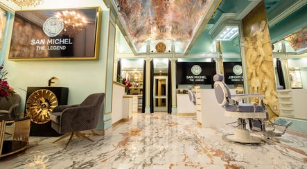 Elegant interior of San Michel The Legend Barbershop in Glendale, California, US with opulent decor and barber chairs.
