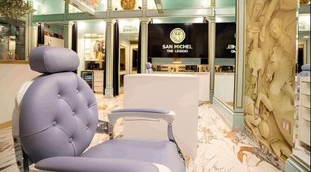 Luxurious interior of San Michel The Legend Barbershop in Glendale, California with a plush barber chair.