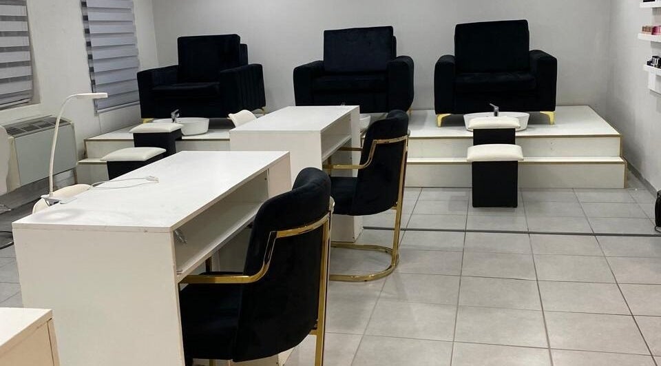Elegant nail service area at The Chosen Beauty Spa, Sandton, Gauteng, ZA with modern black and white decor.