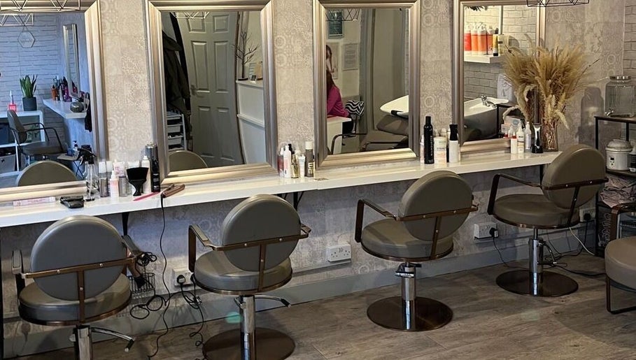 Chic salon interior at Brave, Strong, Beautiful in Edinburgh, Scotland, GB with stylish mirrors and seats.