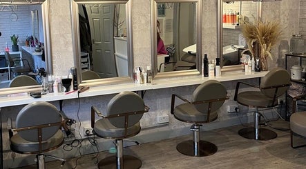 Chic salon interior at Brave, Strong, Beautiful in Edinburgh, Scotland, GB with stylish mirrors and seats.