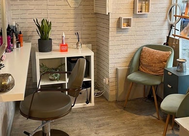 Inviting salon interior at Brave, Strong, Beautiful, Edinburgh, Scotland, GB, featuring styling chair and decor.
