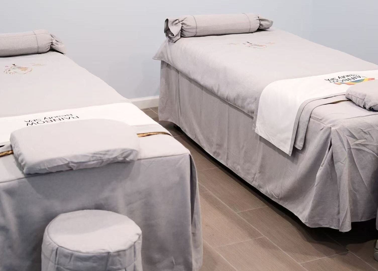 Twin massage beds at Rainbow Beauty Spa, Norristown, Pennsylvania, US, offering serene relaxation.
