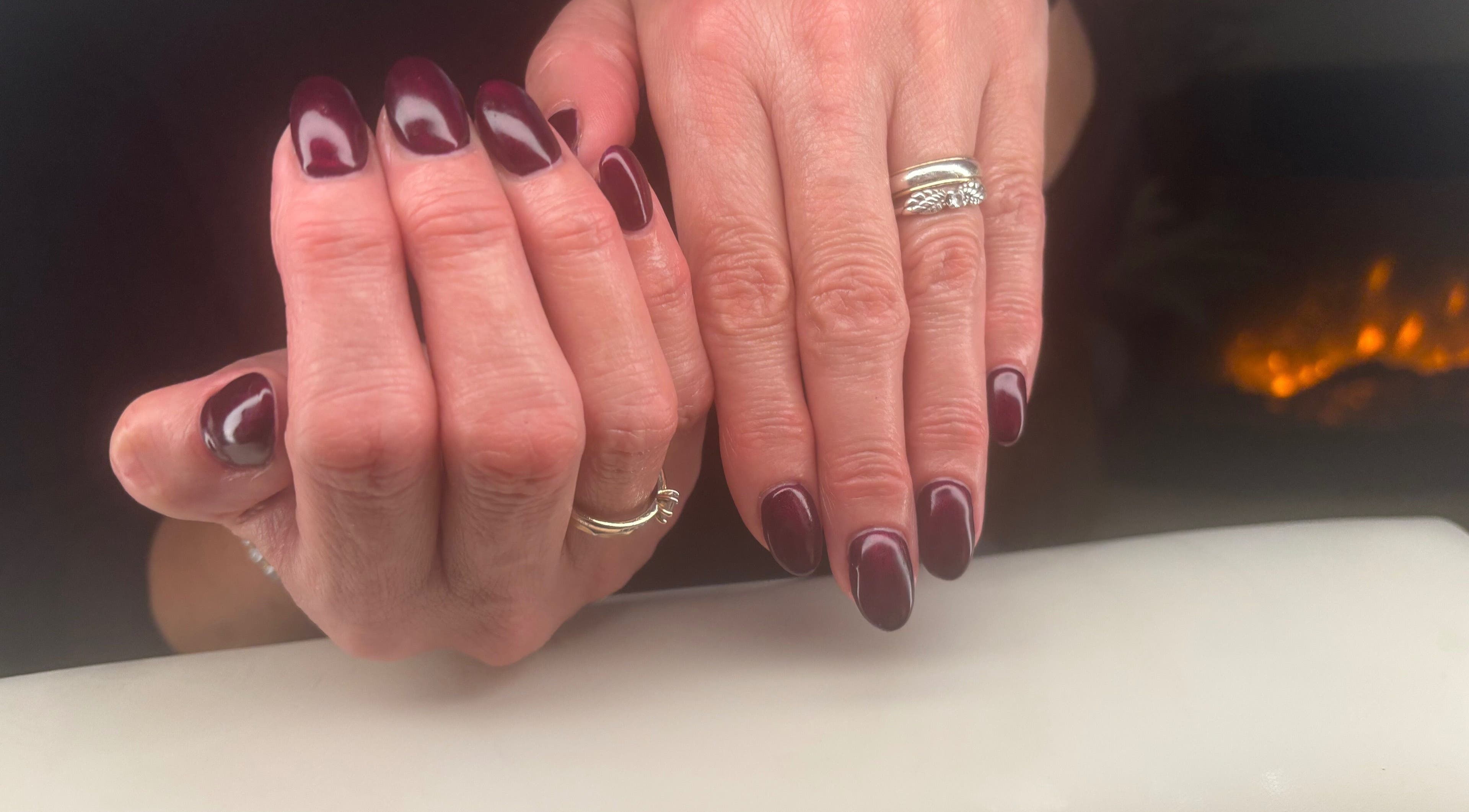 Elegantly manicured burgundy nails at Polished by phebs in Probus, England, GB. Experience perfect nail artistry.
