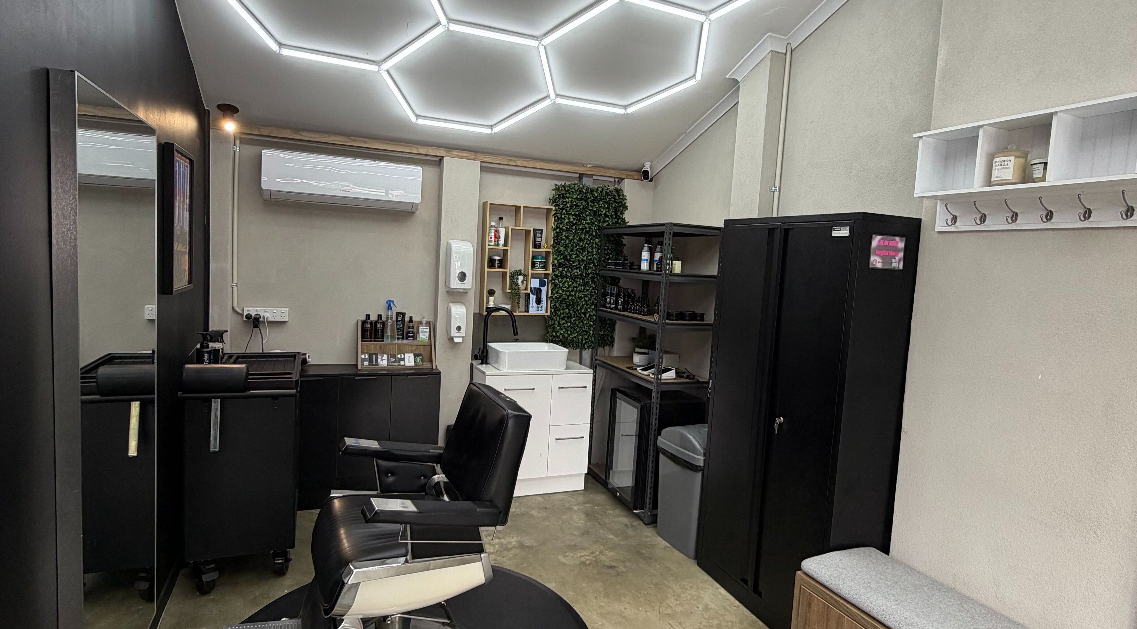 Modern interior of Barber Lounge Melbourne with sleek chairs and stylish decor in Melbourne, Victoria, AU.