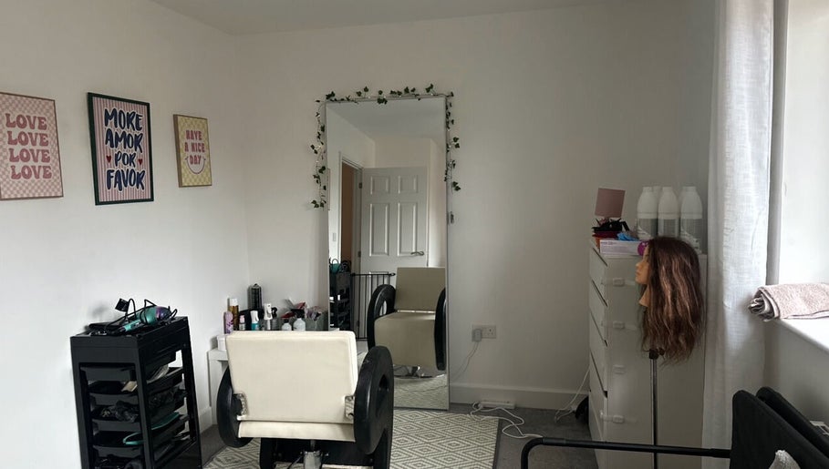 Chic salon interior at Blowoutbysophieelle, Wokingham, England, GB. Features styling chair and mirror.