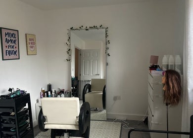 Chic salon interior at Blowoutbysophieelle, Wokingham, England, GB. Features styling chair and mirror.