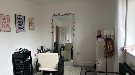 Chic salon interior at Blowoutbysophieelle, Wokingham, England, GB. Features styling chair and mirror.