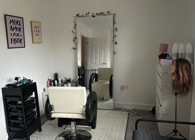Modern salon interior at Blowoutbysophieelle, Wokingham, England, GB, with styling chair and mirror.