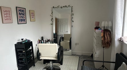 Modern salon interior at Blowoutbysophieelle, Wokingham, England, GB, with styling chair and mirror.