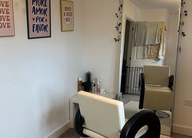 Sleek hair salon chair at Blowoutbysophieelle, Wokingham, England, GB, featuring modern decor and styling tools.