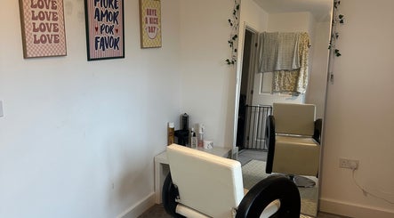 Sleek hair salon chair at Blowoutbysophieelle, Wokingham, England, GB, featuring modern decor and styling tools.