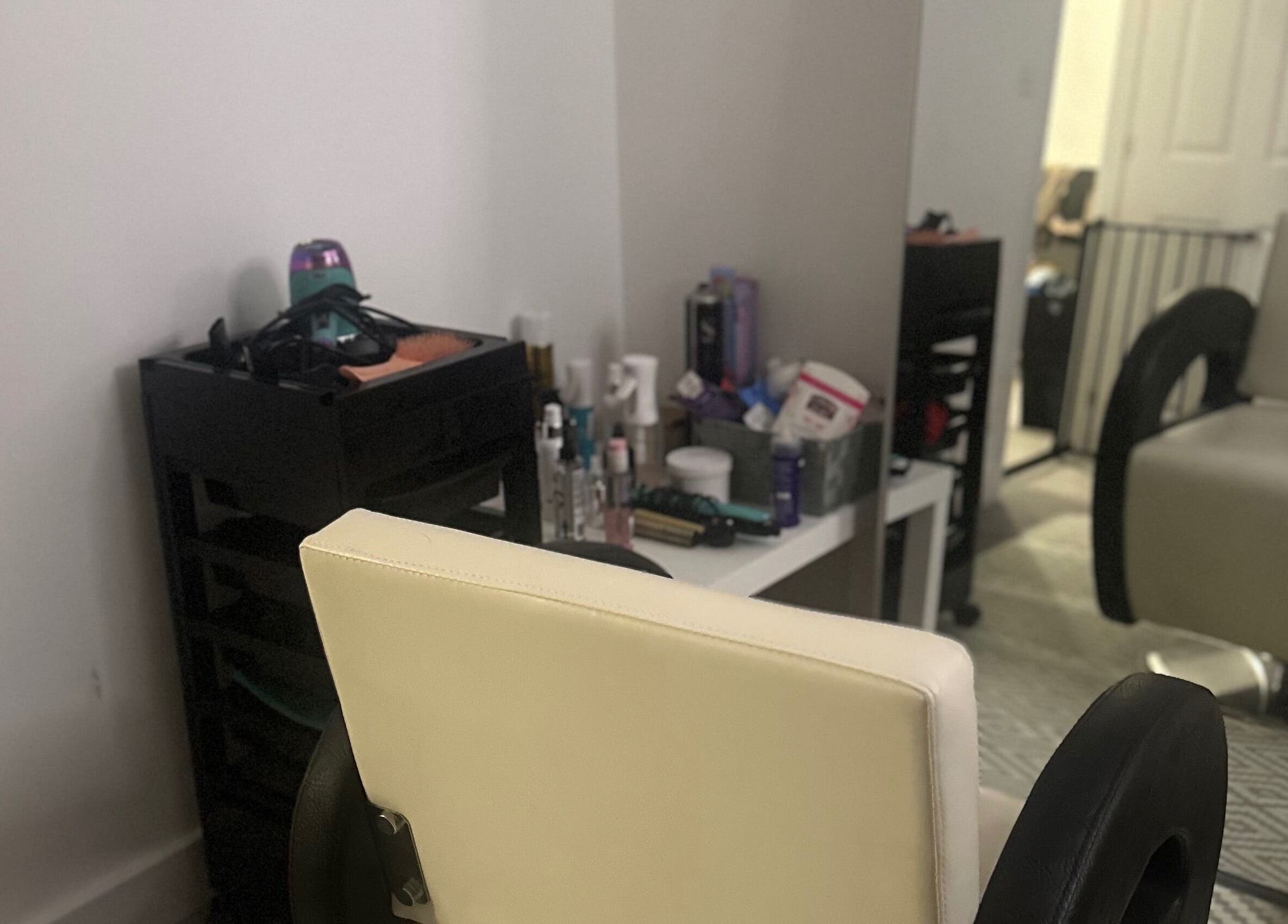 Cozy styling station at Blowoutbysophieelle, Wokingham, England, GB with stylish interior setup.