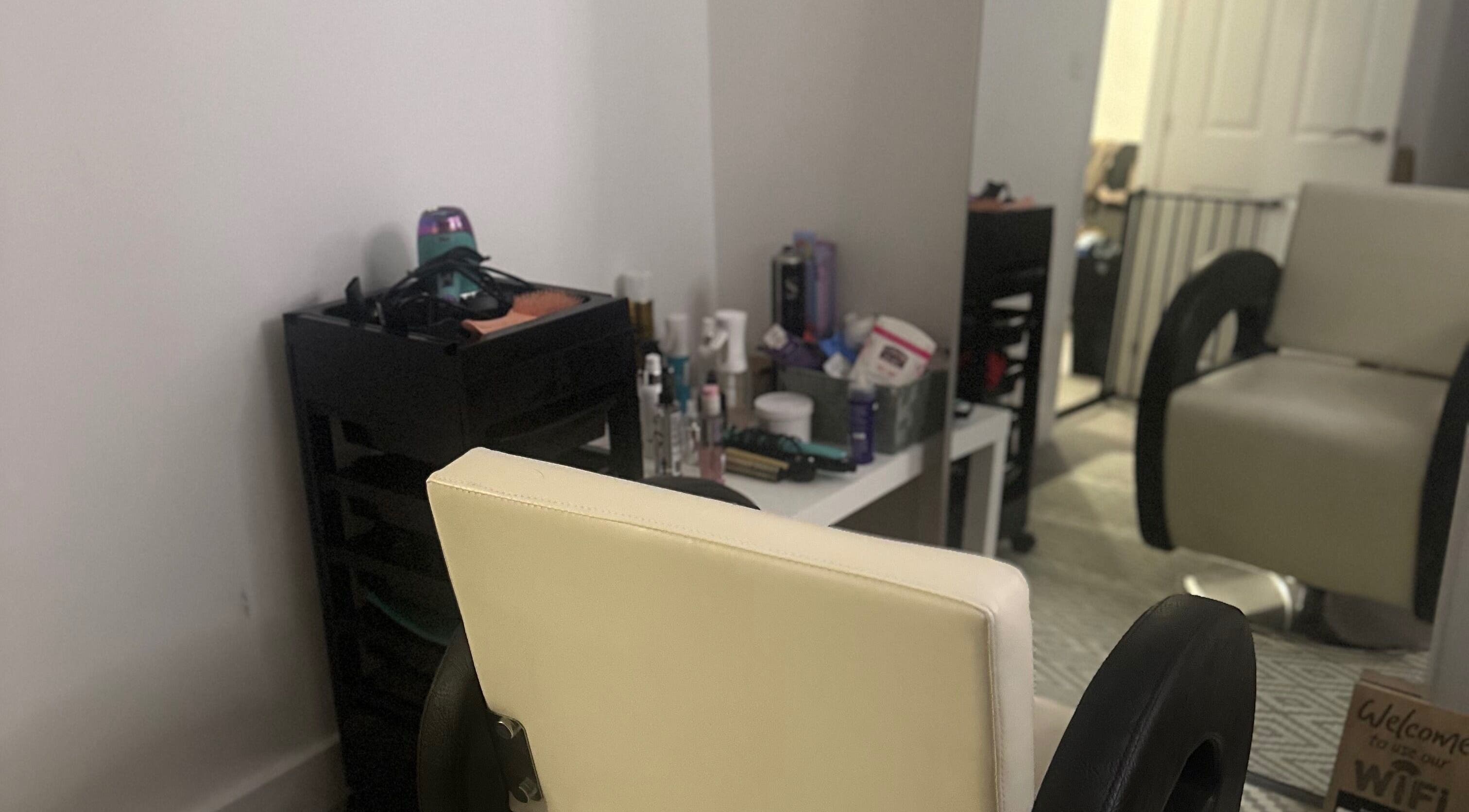 Cozy styling station at Blowoutbysophieelle, Wokingham, England, GB with stylish interior setup.