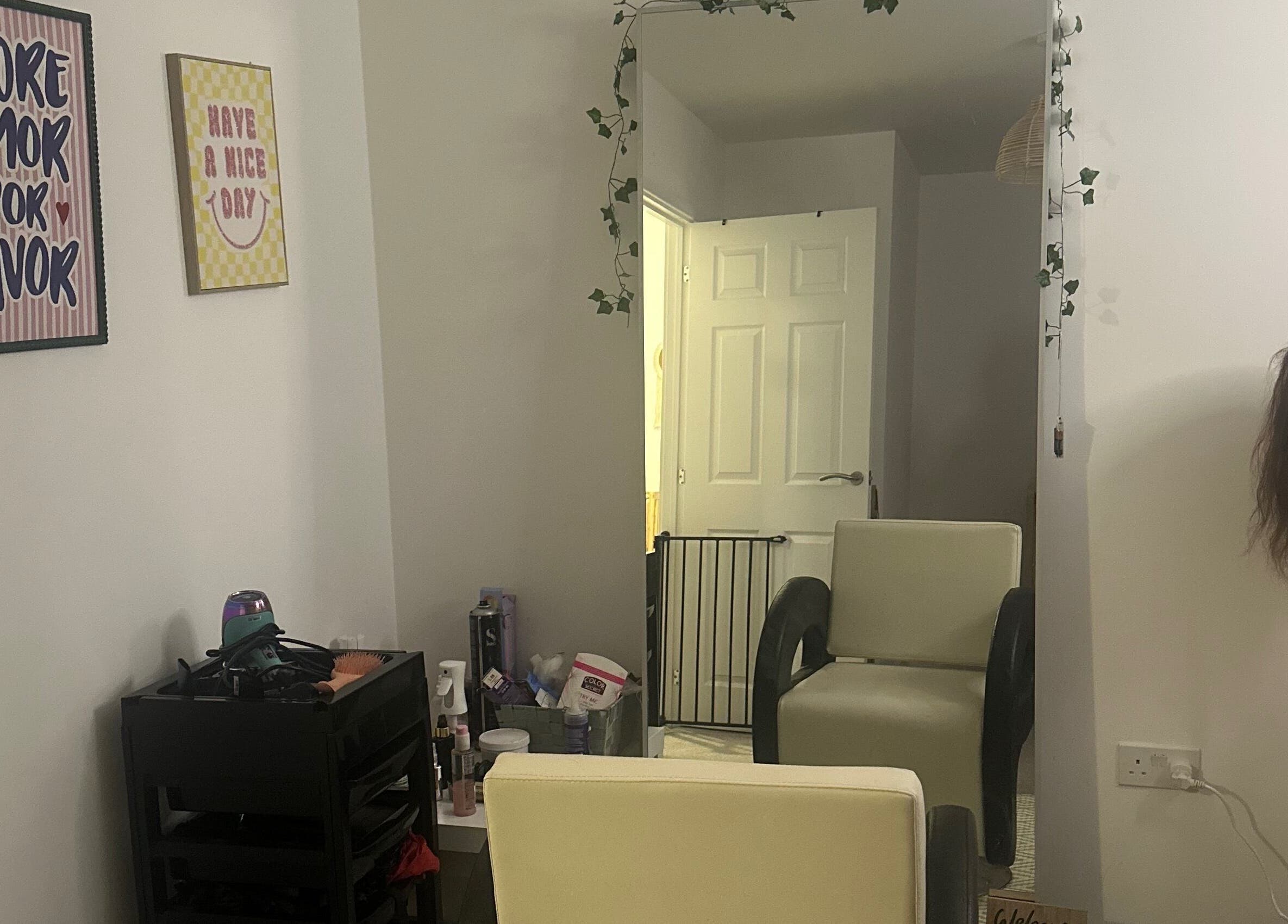 Cozy interior of Blowoutbysophieelle salon in Wokingham, England, with hair tools and decor accents.