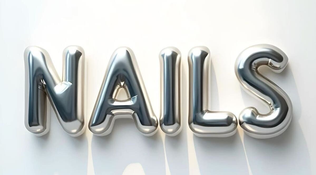 Chrome balloon letters spelling 'NAILS' at Lumi Nail Studio, Vancouver, British Columbia, CA.